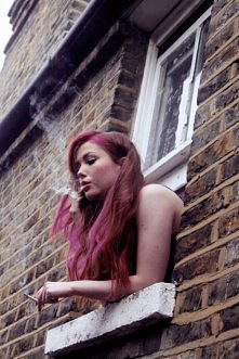 girl smoking at the window