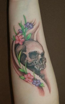 skull forearm tattoo