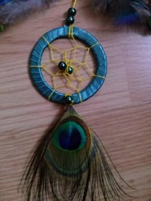 Malutki seledynowo-żółty łapacz z pawim oczkiem ;)