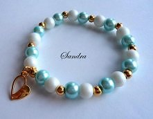 Bransoletka na gumce jubilerskiej ,koraliki powlekane matowe ,perełki szklane ,kulki metalowe ,elementy ozdobne kolor złoty :)