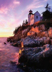 The Bass Harbor Head Lighthouse glows on shore of the Mount Desert Island in Northern Maine.