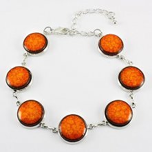 Pomarańczowa bransoletka Bransoletka wykonana z ceramicznych elementów szkliwionych pięknym pomarańczowym szkliwem. Baza bransoletki w kolorze srebrnym. w kuferart.pl