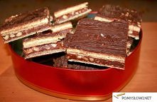 mleczna:

1/4 szklanki mleka
175 g miękkiego masła
1 (szklanka 200ml kopiasta) szklanka mleka w proszku
1 łyżeczka aromatu waniliowego

Masa czekoladowo-orzechowa:

100 g masła
...