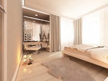 Projekt wnętrza eleganckiej sypialni w willi pod Warszawą. Przestronna sypialnia z toaletką odbijająca się w dekoracyjnych lustrach.