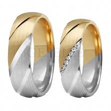 ST 280 ciekawe dwukolorowe obrączki ślubne z nacięciami i brylantami od GESELLE Jubiler. Obrączki możemy również wykonać w całości z białego, żółtego albo czerwonego złota.