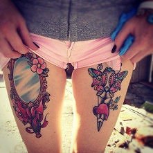 woman thigh tattoo