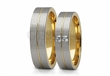 ST 245 Nowoczesne obrączki ślubne z białego złota pokrytego satynowym matem i delikatną linią oraz kamieniami - GRAWER W PREZENCIE z kolekcji GESELLE Jubiler