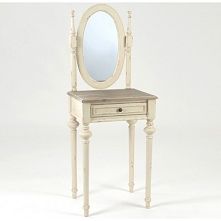 Mała toaletka z lusterkiem o owalnym kształcie, ciemnym kwadratowym blacie a także nogami zdobionymi w typowym stylu prowansalskim.