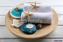 Marine style spa composition in a bowl on wooden background