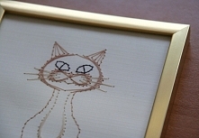 Kartka (ramka) wykonana metodą haftu matematycznego.