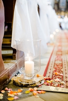 Candles and petals in church, wedding ceremony.