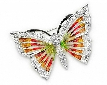 Broszka posrebrzana w formie motylka, z grzbietem wysadzanym oryginalnymi, kryształowymi dżetami i ręcznie pokryta drobinkami kolorowego szkła, zabezpieczona filtrem UV. Nie zaw...