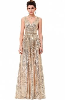 Wieczorowa długa złota sukienka z cekinów. Dekolt kopertowy. Sukienka zapinana z tyłu na zamek. Pod spodem podszewka. Suknia idealna na sylwestra jak również na karnawał. Z pewn...