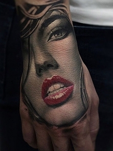 face hand tattoo