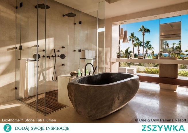 Freestanding stone #bathtub River stone tub in hotel #bathroom. See our full collection of #natural stone products. The #stonebathtub in this #hotel was made of river stone. This is a monument. We produce high quality natural stone bathtubs and deliver them to any country in the world. We are looking for importers, wholesalers, interior designer. Get to know our stone tubs, stone basins, soaking stone bathtub & #freestanding stone #bath tubs.