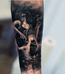 amaizing tattoo cello skull