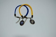 Bransoletka z podwójnego, plecionego rzemienia + zawieszka godło Ravenclaw i Hufflepuff
Kolekcja: Harry Potter
Rodzaj: Biżuteria