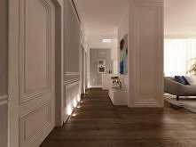 Eleganckie wnętrze luksusowego apartamentu na Mokotowie. W całym mieszkaniu dodaliśmy dekoracje w postaci sztukaterii na sufitach i ścianach, aby podkreślić klasyczny styl wnętrza.