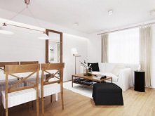 Projekt poddasza w stylu prowansalskim - Tissu. Aranżacja wnętrza salonu z elementami stylu francuskiego, z ceglanym murem i naturalnym drewnem.