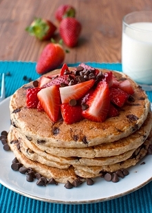 Chocolate chip oatmeal pancakes with strawberries.