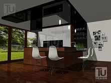 Biały kolor zabudowy kuchennej i wykończenie frontów na wysoki połysk idealnie komponuje się z czarnym blatem, który nachodzi również na ścianę. Nowoczesna, jednak chłodna aranż...