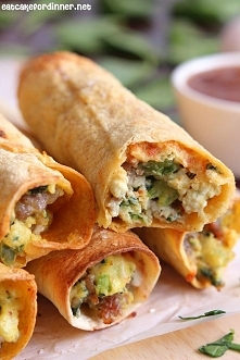 A baked taquito that is crispy on the outside and loaded with flavorful breakfast ingredients on the inside.