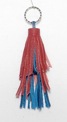 chwost frędzel dwu kolorowy plus metalowe sprężynowe kółko fantastyczny dodatek do torebki zamka do kurtki i jeszcze co tylko tak gdzie siega wyobraznia