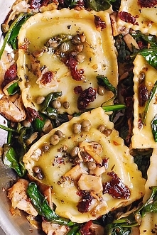 RAVIOLI WITH SPINACH, ARTICHOKES, CAPERS, SUN-DRIED TOMATOES