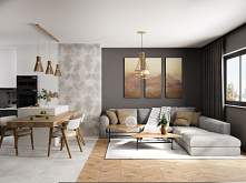Nowoczesny salon w szarościach i drewnie. Od kuchni oddziela go stół jadalniany.